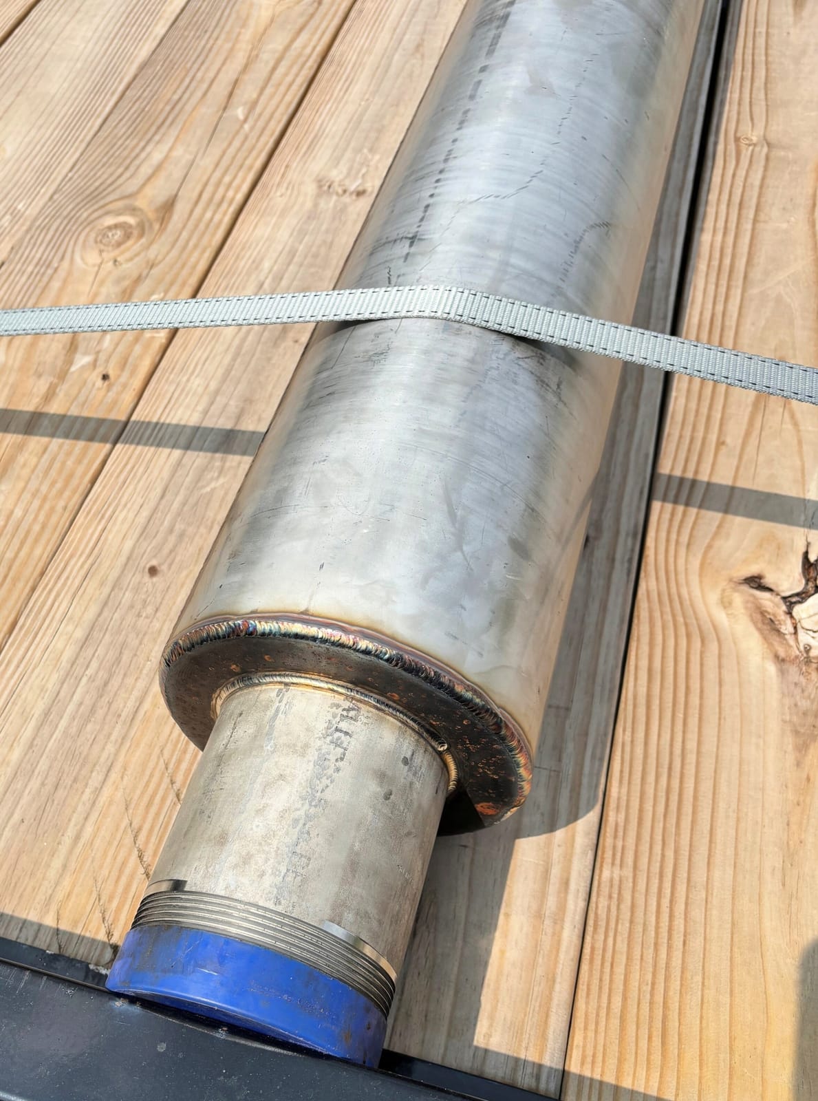 A welded adapter section with a threaded pipe connection below the sleeve.